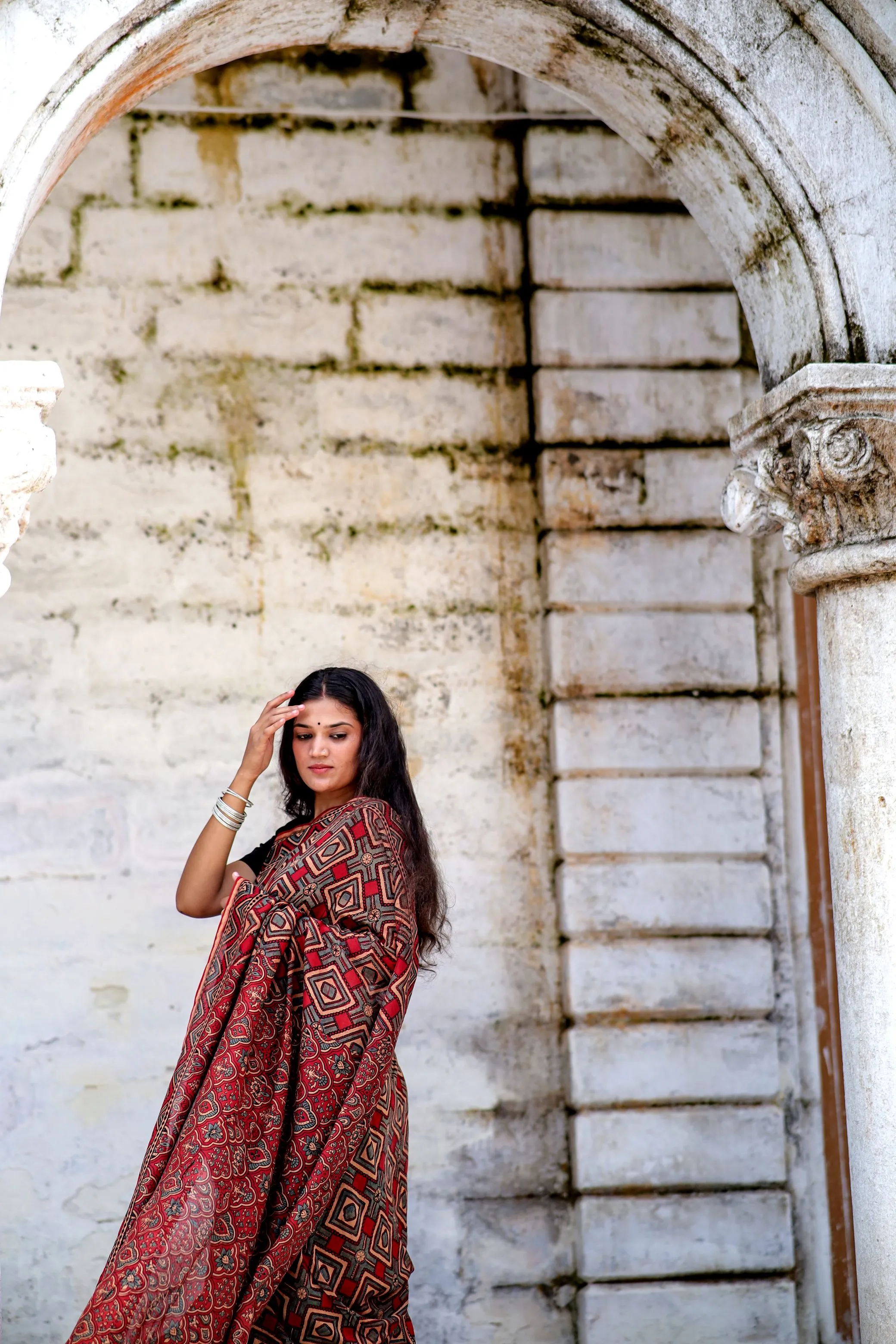 A trsyt with Ajrakh -Jharokha -Triangle Black and Red Chanderi ajrakh saree