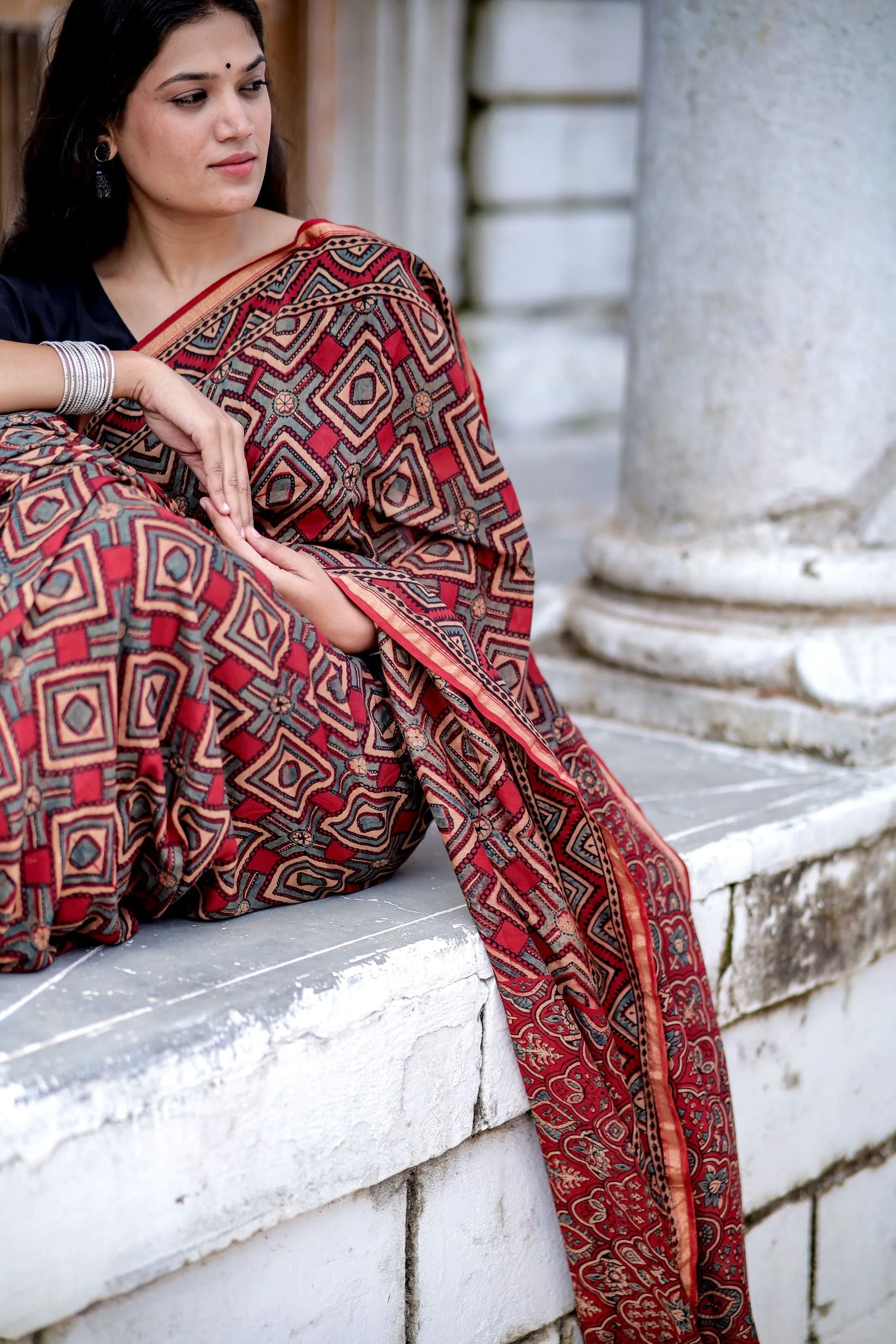 A trsyt with Ajrakh -Jharokha -Triangle Black and Red Chanderi ajrakh saree
