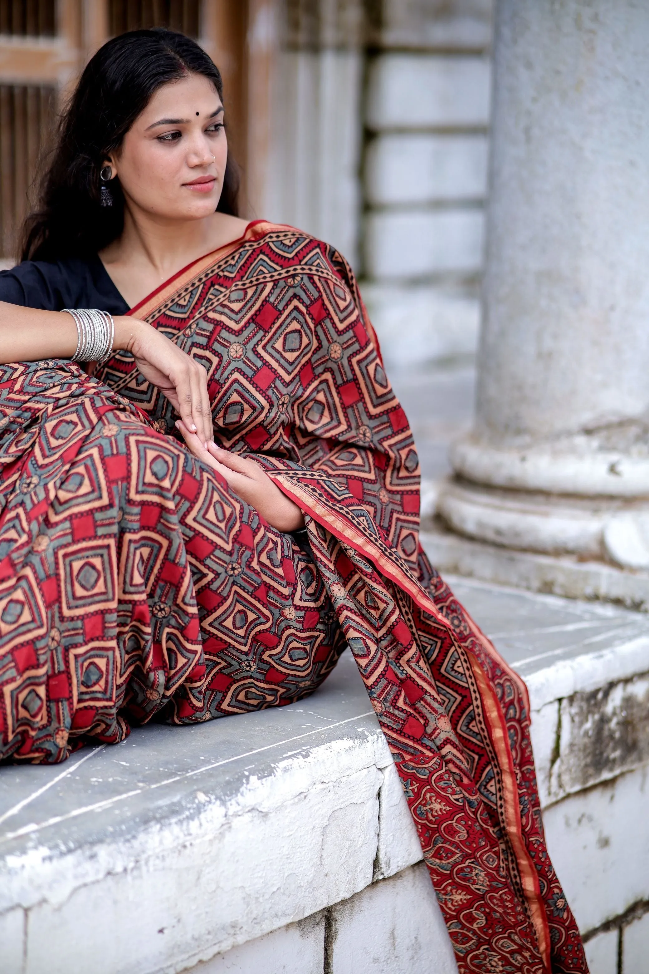A trsyt with Ajrakh -Jharokha -Triangle Black and Red Chanderi ajrakh saree