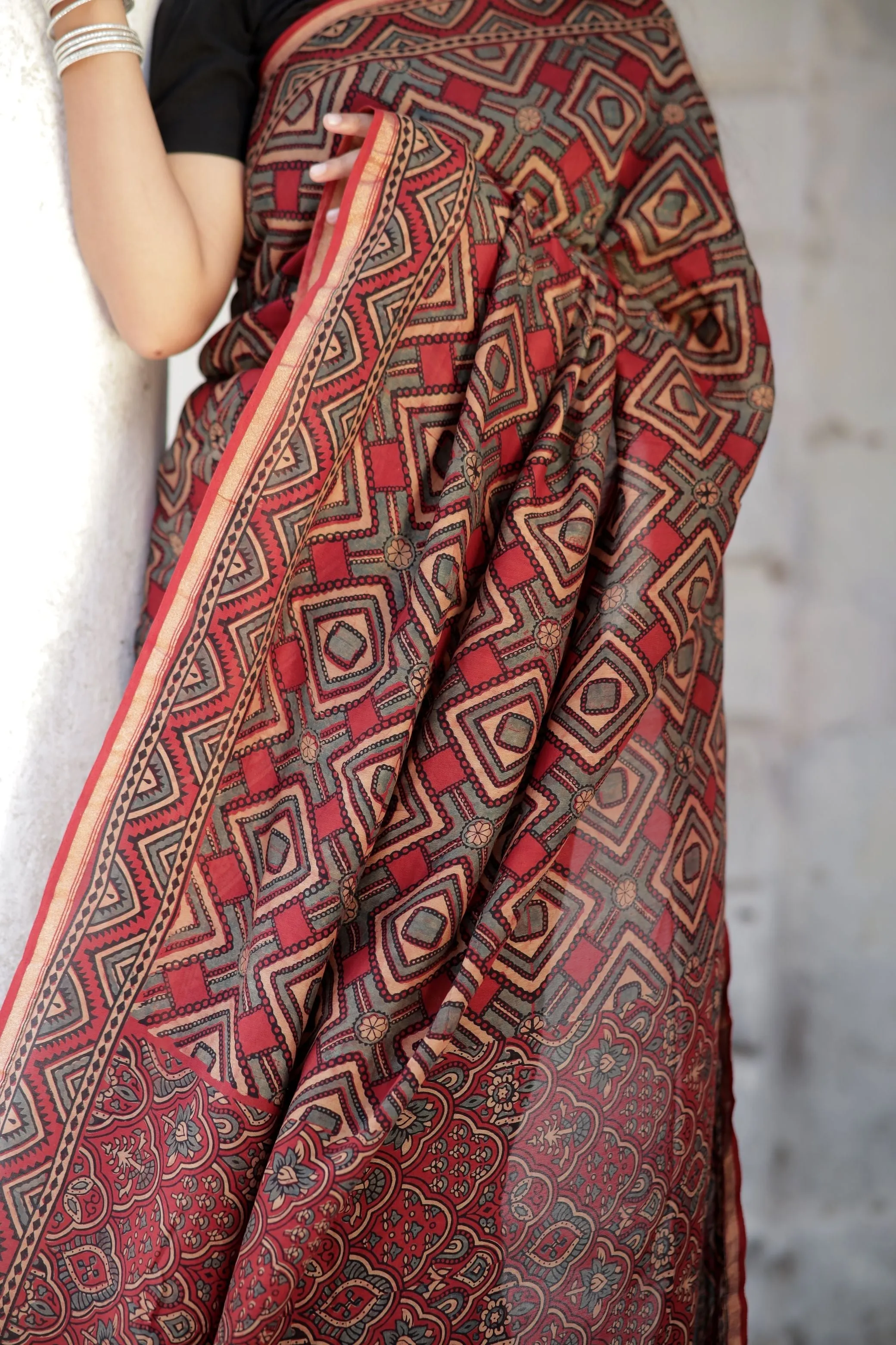 A trsyt with Ajrakh -Jharokha -Triangle Black and Red Chanderi ajrakh saree