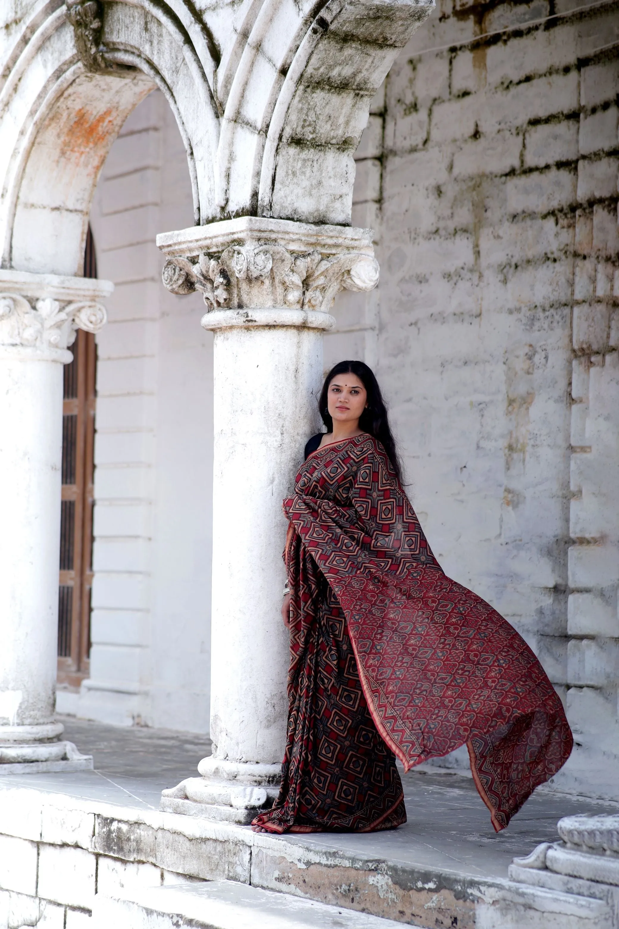 A trsyt with Ajrakh -Jharokha -Triangle Black and Red Chanderi ajrakh saree