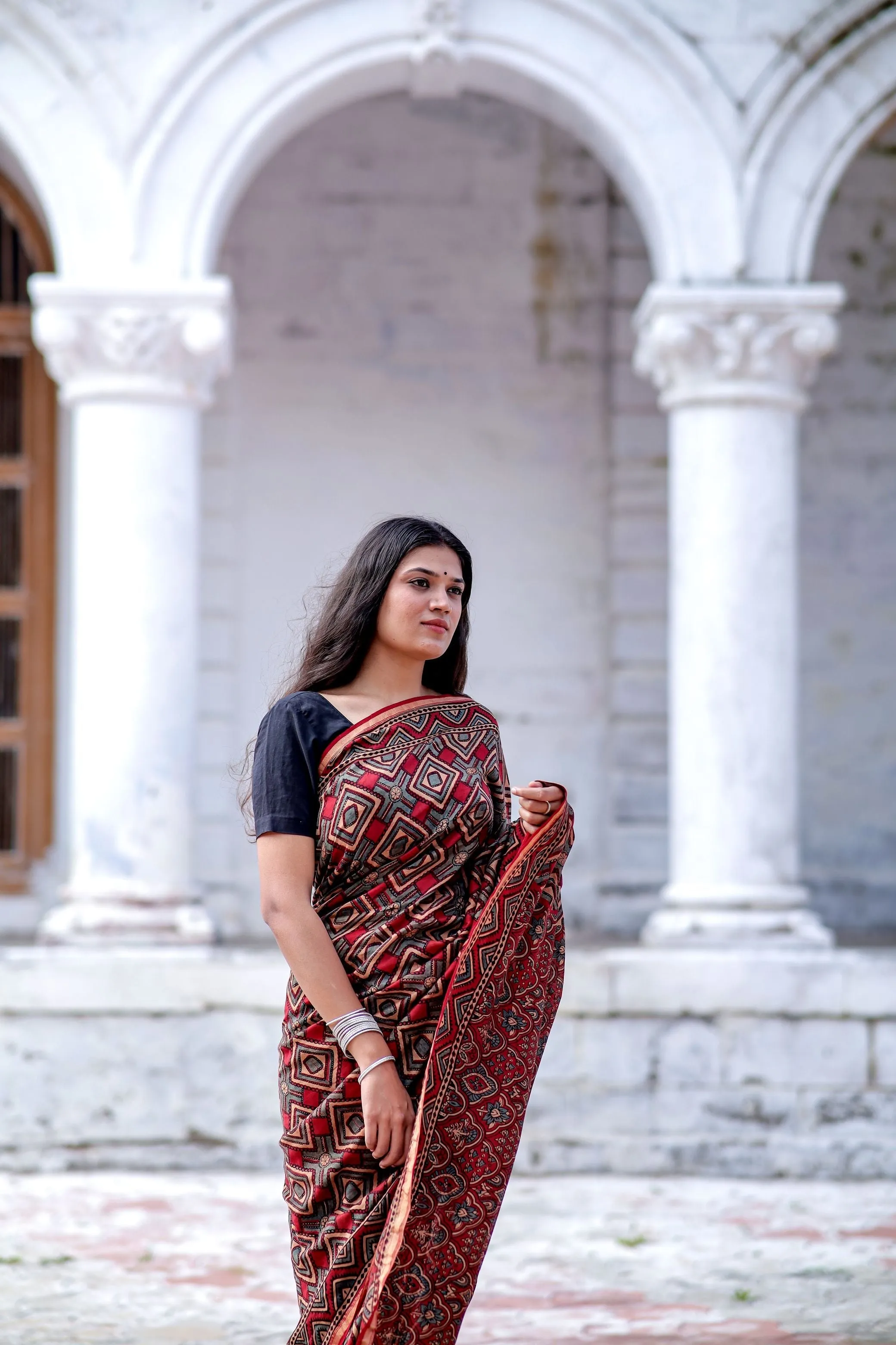 A trsyt with Ajrakh -Jharokha -Triangle Black and Red Chanderi ajrakh saree