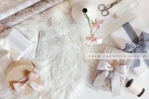 Gifts, Flowers & Wrapping Paper on White Background, Stock Image